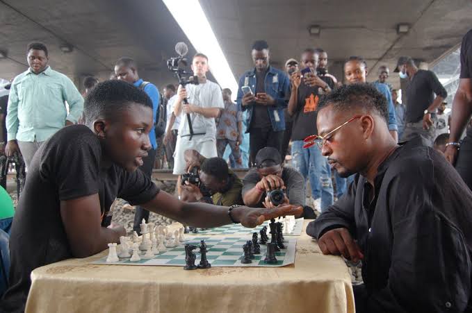 VIDEO: Moment Man United legend Patrice Evra visits Oshodi under bridge, plays chess with children